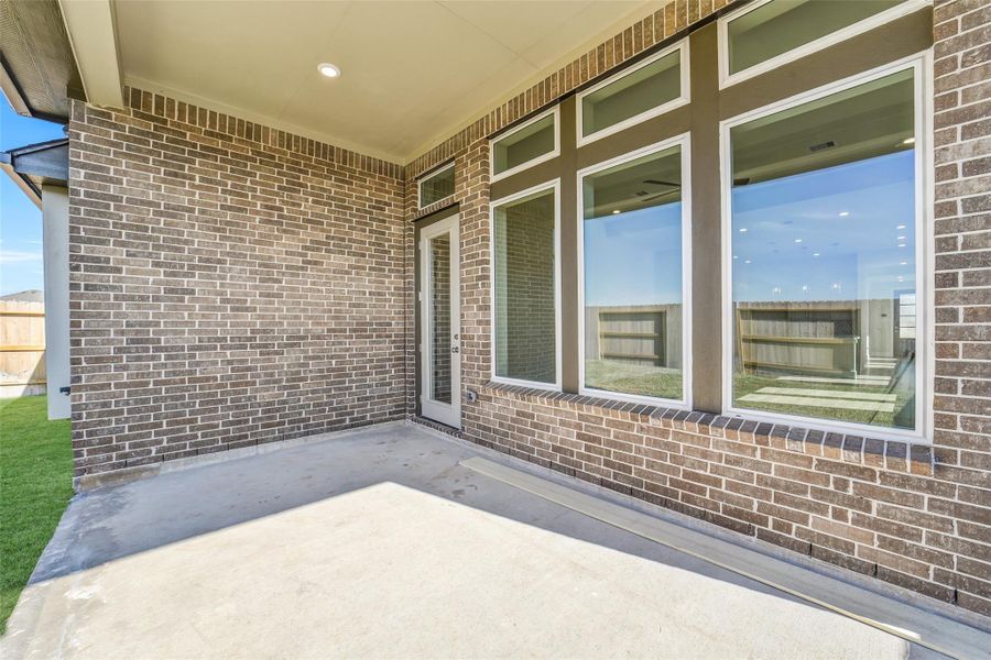 Exterior details and patio area of a home in Sunterra, Katy (Image 24).