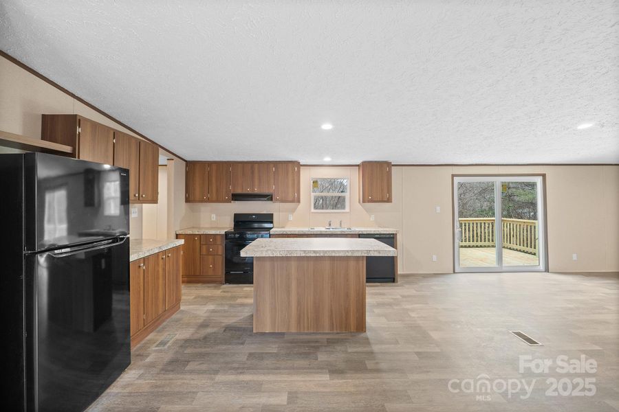 Furnished interior view inside a new home in , Lenoir (Image 2).