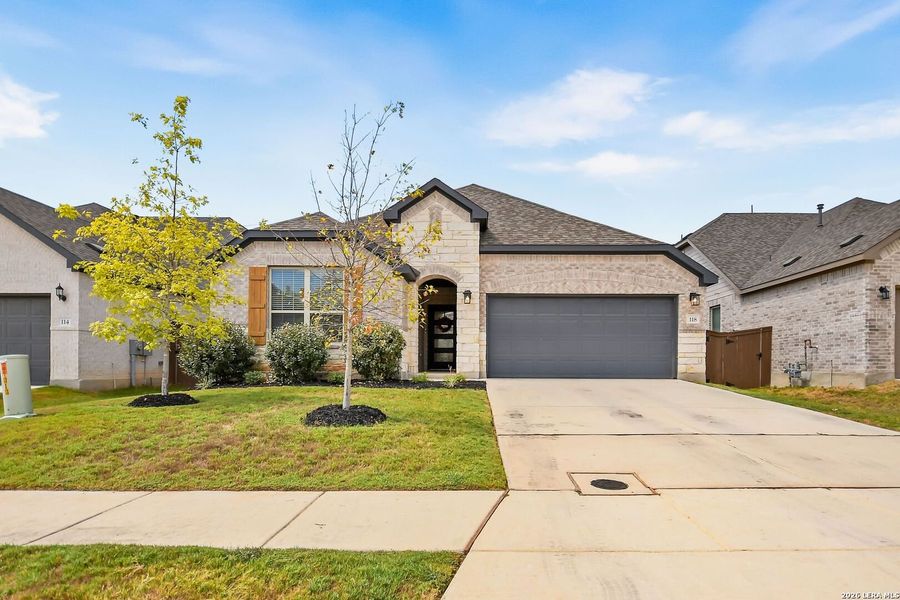 Front exterior of a new home in Corley Farms, Boerne, TX, highlighting curb appeal (Image 24). Front exterior of a new home in Corley Farms, Boerne, TX, highlighting curb appeal (Image 24).