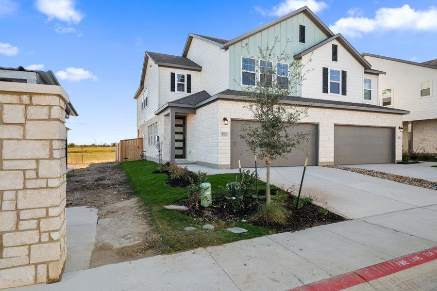 Front exterior of a new home in Union Collection at Park Central, Georgetown, TX, highlighting curb appeal (Image 2).