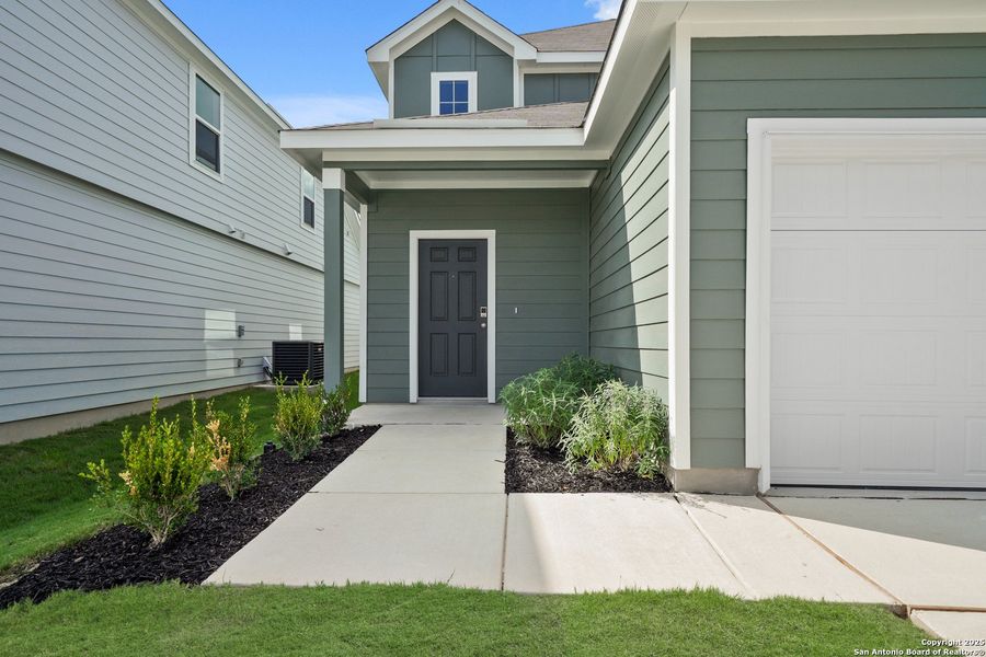 Front exterior of a new home in Timber Creek, San Antonio, TX, highlighting curb appeal (Image 20). Front exterior of a new home in Timber Creek, San Antonio, TX, highlighting curb appeal (Image 20).