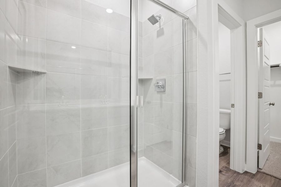 A bathroom with a glass shower.
