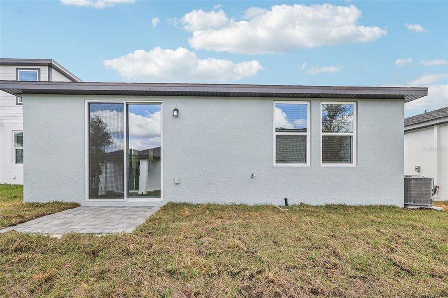 Exterior details and patio area of a home in Wynnstone - Classic Series, Haines City (Image 20).