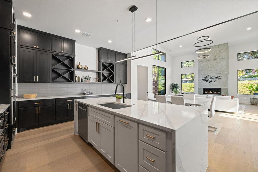 The bright and open floor plan makes it easy to stay connected with friends and family throughout the main living area.