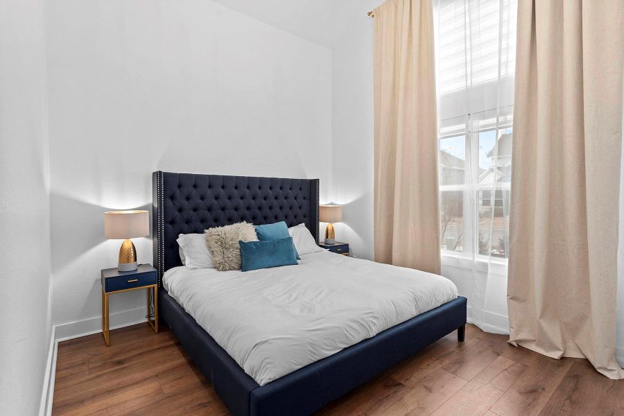 Bedroom featuring dark hardwood / wood-style flooring