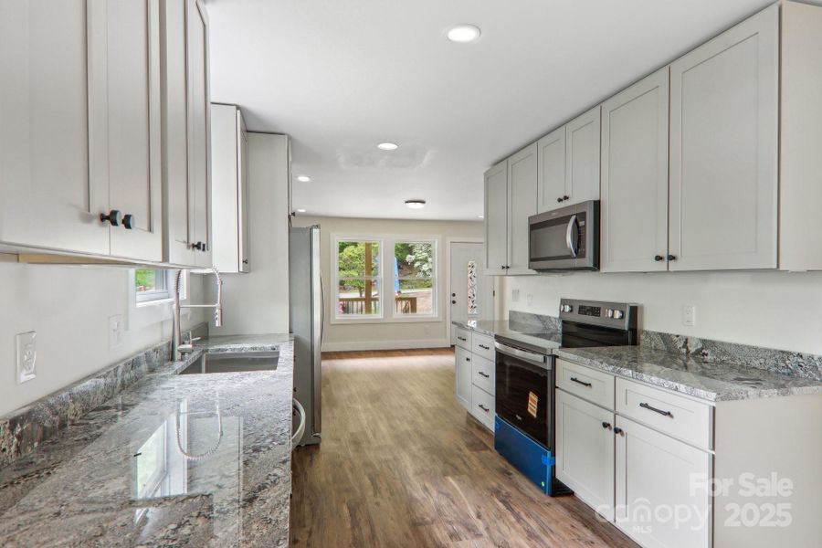 Furnished interior view inside a new home in , Waynesville (Image 12).