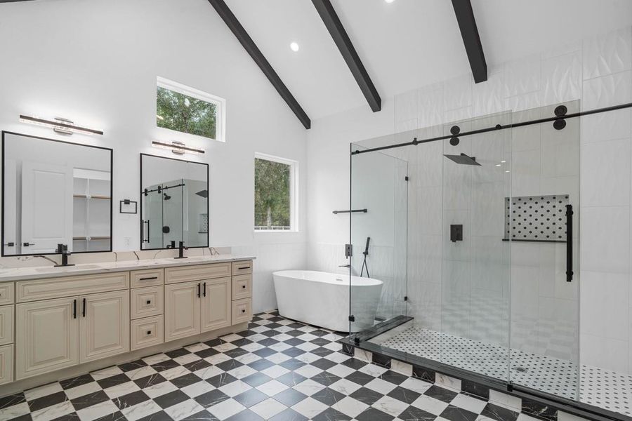 Huge primary bath with double vanity, checkerboard floors, huge walk-in shower with tub. Huge primary bath with double vanity, checkerboard floors, huge walk-in shower with tub.