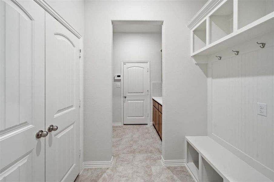 Mudroom featuring baseboards Mudroom featuring baseboards