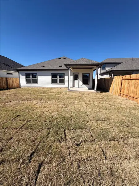 Rear of Home and Private Backyard