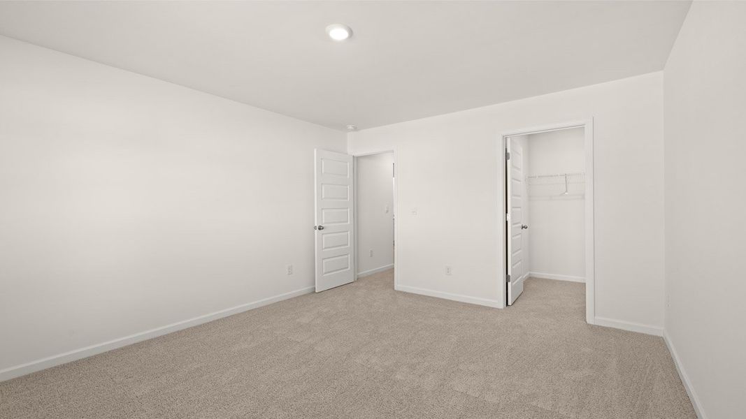 Representative unfurnished interior of a home built from the Mansfield by D.R. Horton in Brooks Station, Dacula (Image 31).