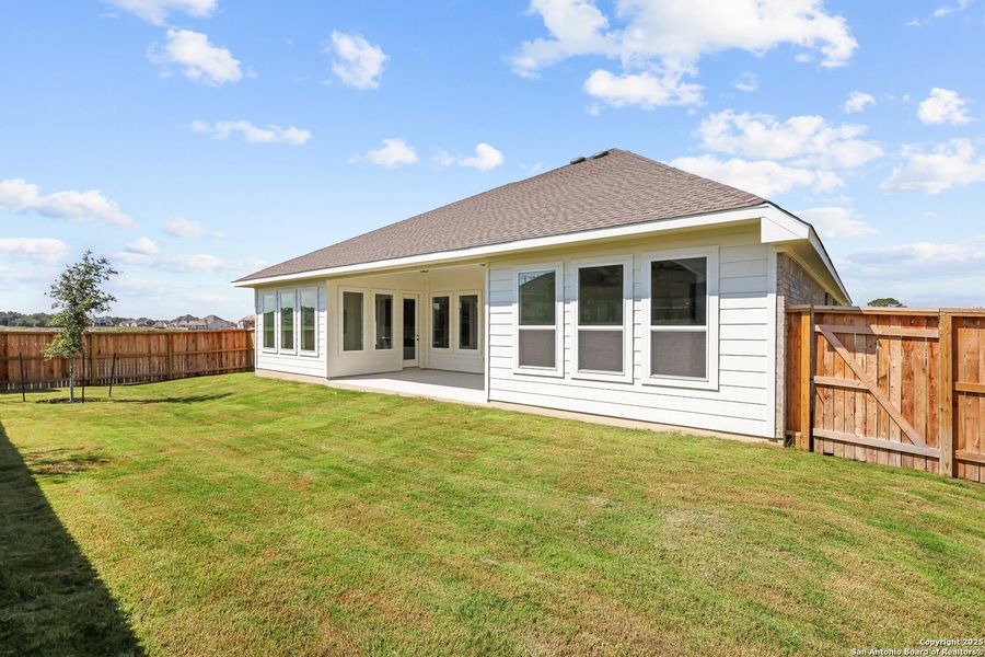 Front exterior of a new home in Megan's Landing, Castroville, TX, highlighting curb appeal (Image 20).