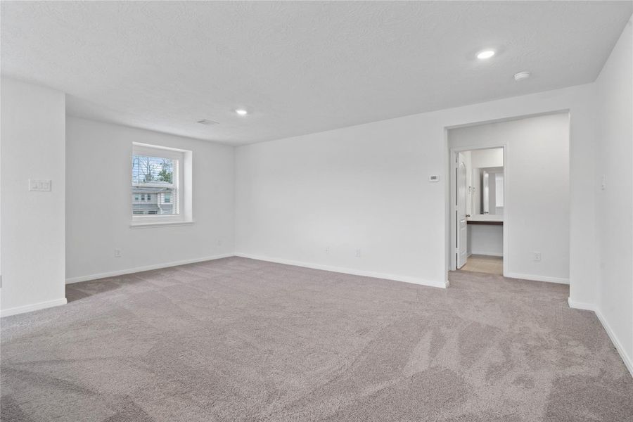 Additional Game Room views that leads you to the hallway of the secondary bedrooms and bathroom.