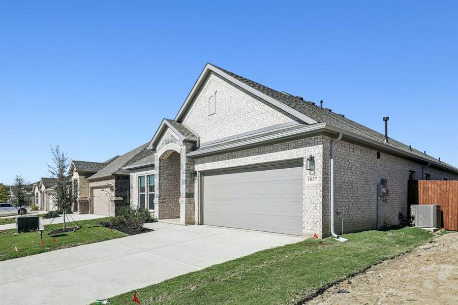 Front exterior of a new home in , Alvarado, TX, highlighting curb appeal (Image 1).