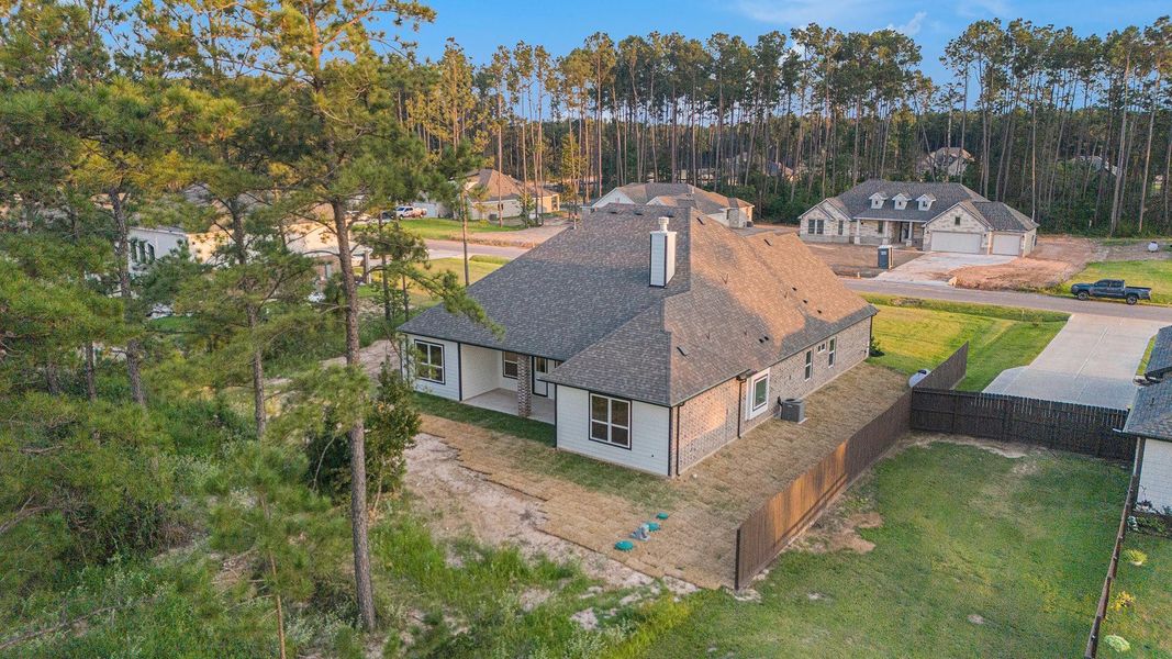 Front exterior of a new home in Deer Pines, Conroe, TX, highlighting curb appeal (Image 19). Front exterior of a new home in Deer Pines, Conroe, TX, highlighting curb appeal (Image 19).