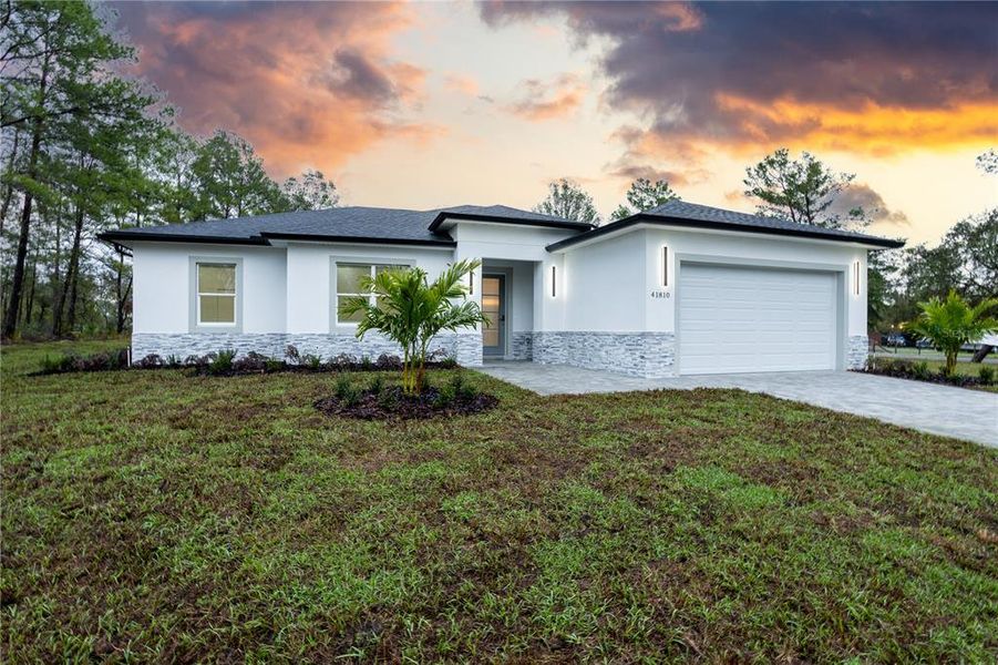 Front exterior of a new home in , Eustis, FL, highlighting curb appeal (Image 21).