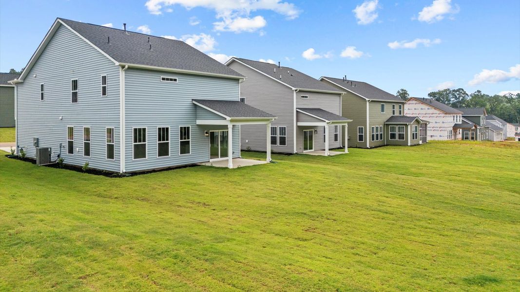 Representative exterior photo of a completed home built from the Neroli by DRB Homes in Fox Hollow, Spartanburg, SC (Image 22).