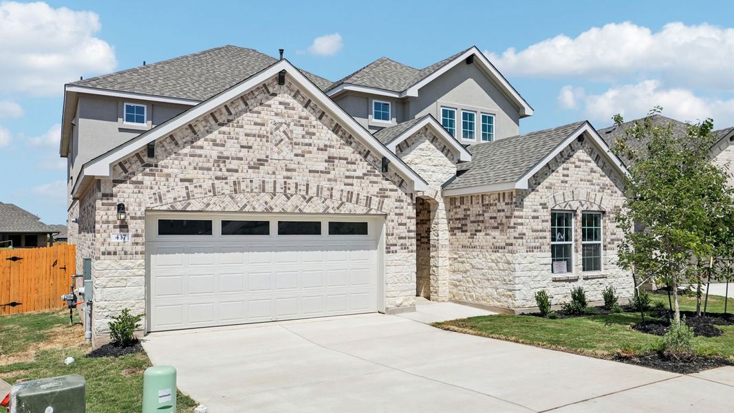 Front exterior of a new home in Rosenbusch Ranch, Leander, TX, highlighting curb appeal (Image 22).