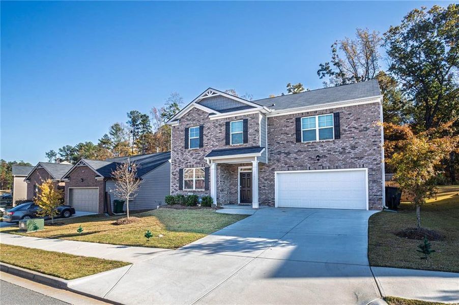 Front exterior of a new home in , Stonecrest, GA, highlighting curb appeal (Image 25).