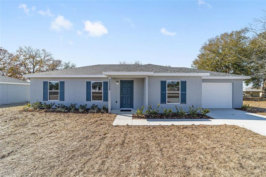 Front exterior of a new home in , Belleview, FL, highlighting curb appeal (Image 2).