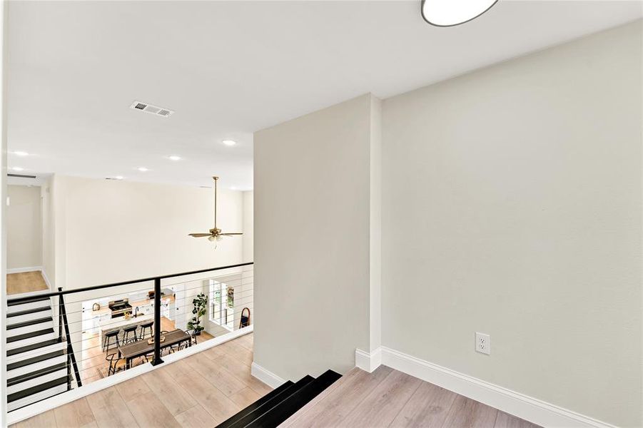 Corridor featuring light hardwood / wood-style floors