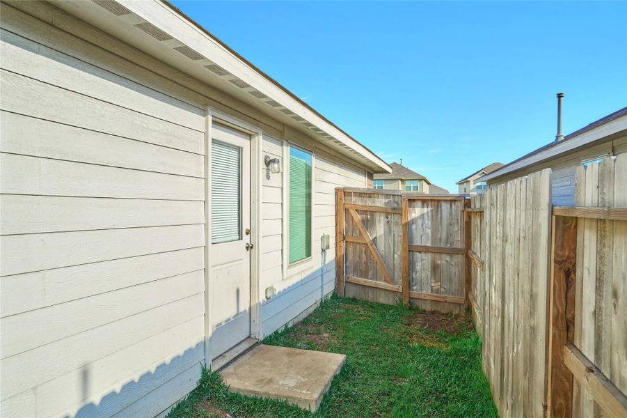 Exterior details and patio area of a home in Tavola: Cottage Collection, New Caney (Image 4).