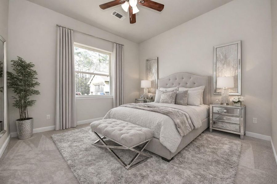 This virtually staged bedroom also includes an en-suite bath.