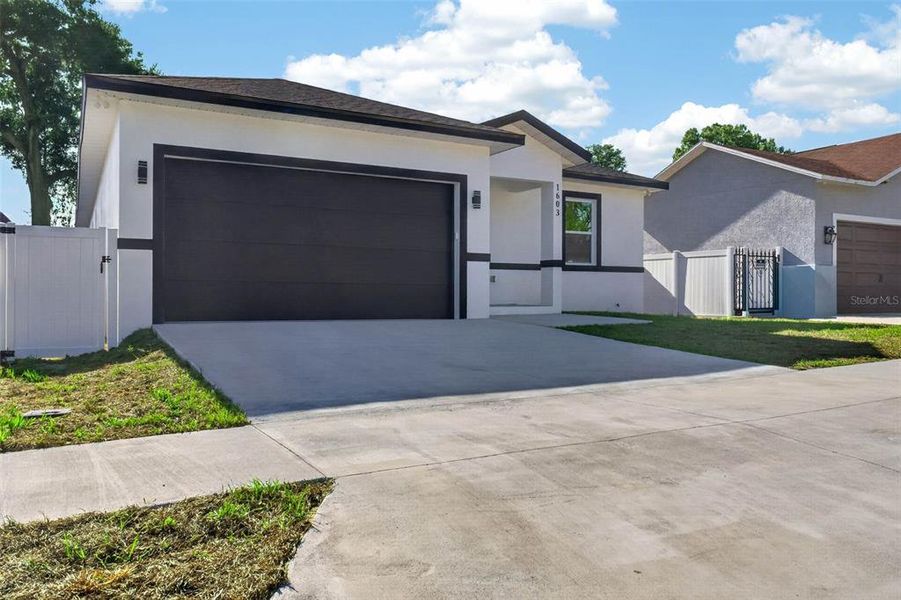 Front exterior of a new home in , Lakeland, FL, highlighting curb appeal (Image 1). Front exterior of a new home in , Lakeland, FL, highlighting curb appeal (Image 1).