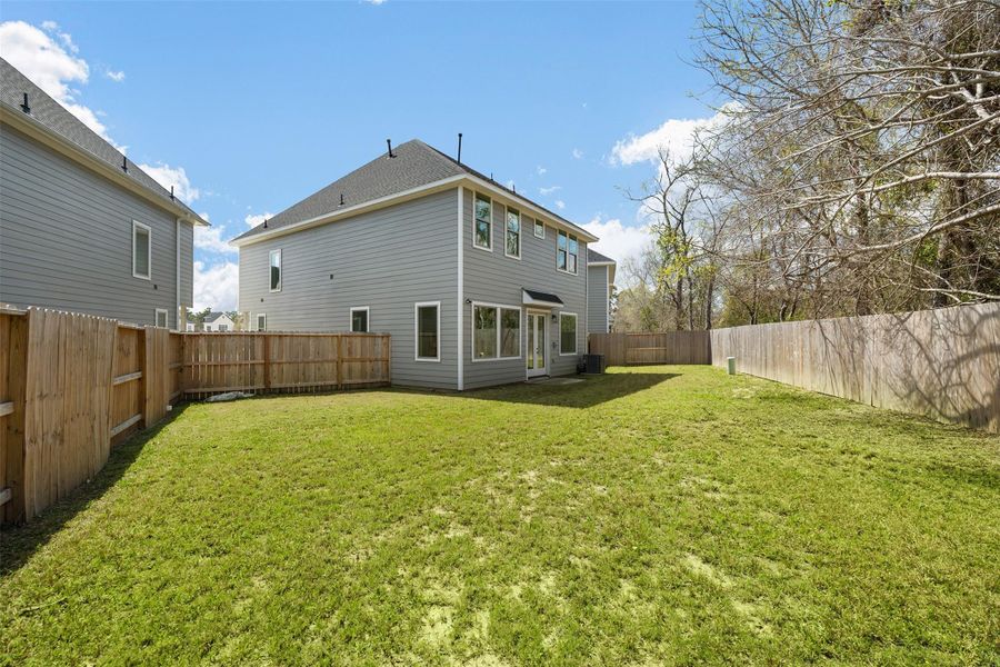 This expansive backyard, situated on one of the largest lots in the neighborhood, offers endless possibilities for outdoor enjoyment. With plenty of open space, it's perfect for hosting gatherings, entertaining guests, or creating a dedicated play area. Whether you're envisioning summer barbecues, cozy fire pit evenings, or simply room to run and play, this backyard provides the ideal setting for making lasting memories.