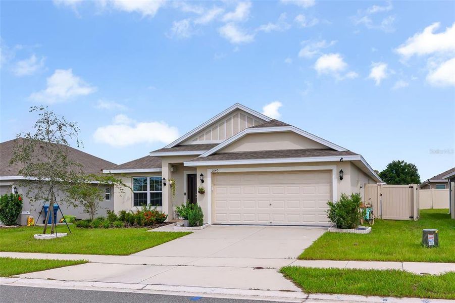 Front exterior of a new home in Citrus Landing, Davenport, FL, highlighting curb appeal (Image 20).