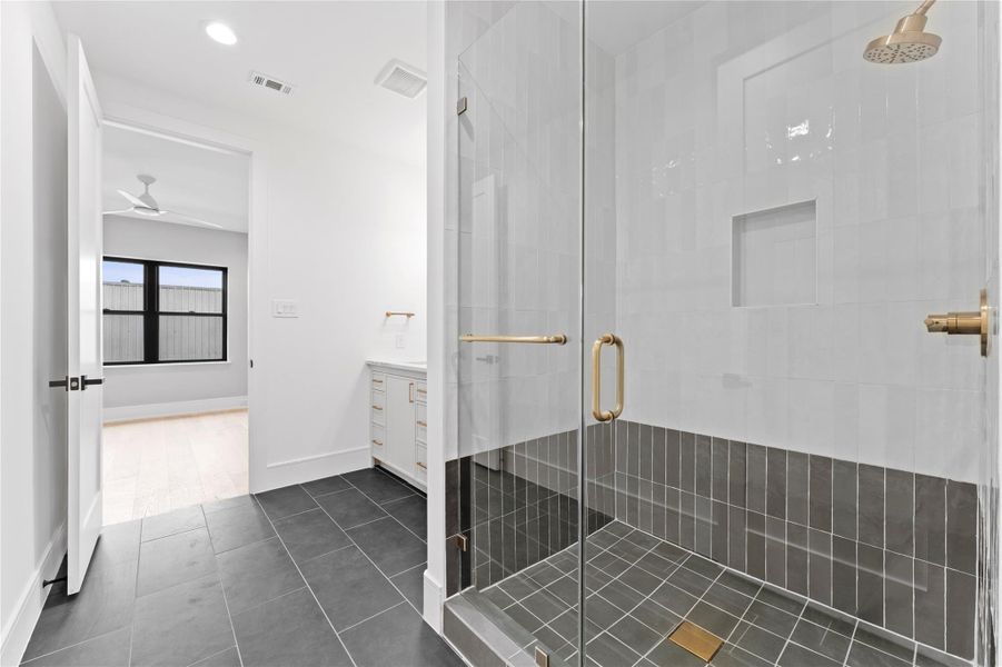 Oversized glass shower with premium tile.