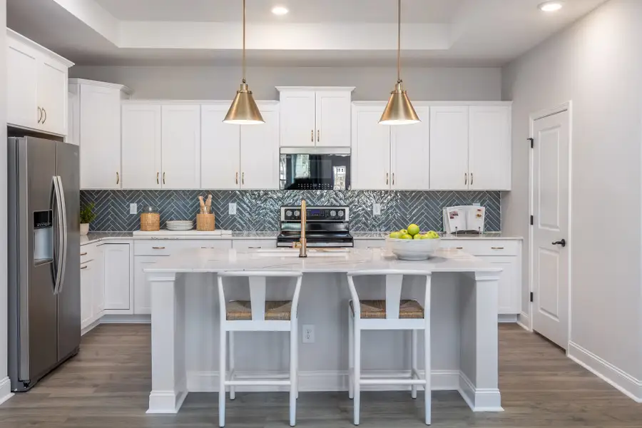 Representative furnished interior of a home built from the Promenade by McKee Homes in The Cottages at 78 North, Sanford (Image 7).