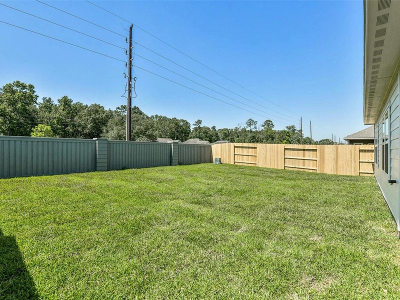 Exterior details and patio area of a home in Sundance Cove, Crosby (Image 20).