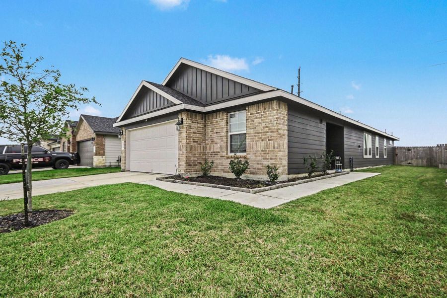 Front exterior of a new home in Caldwell Ranch, Rosharon, TX, highlighting curb appeal (Image 22).