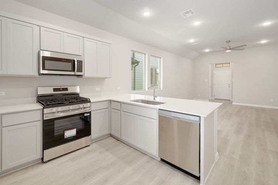 Kitchen in the Ash home plan by Trophy Signature Homes – REPRESENTATIVE PHOTO