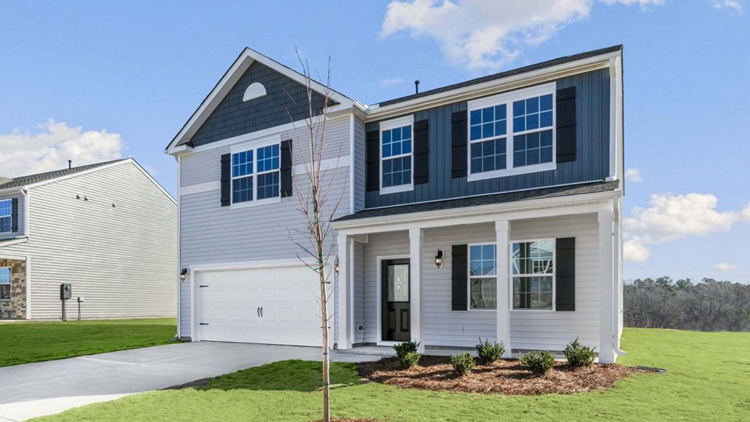 Front exterior of a new home in Ridgewood Farms, Winterville, NC, highlighting curb appeal (Image 18).