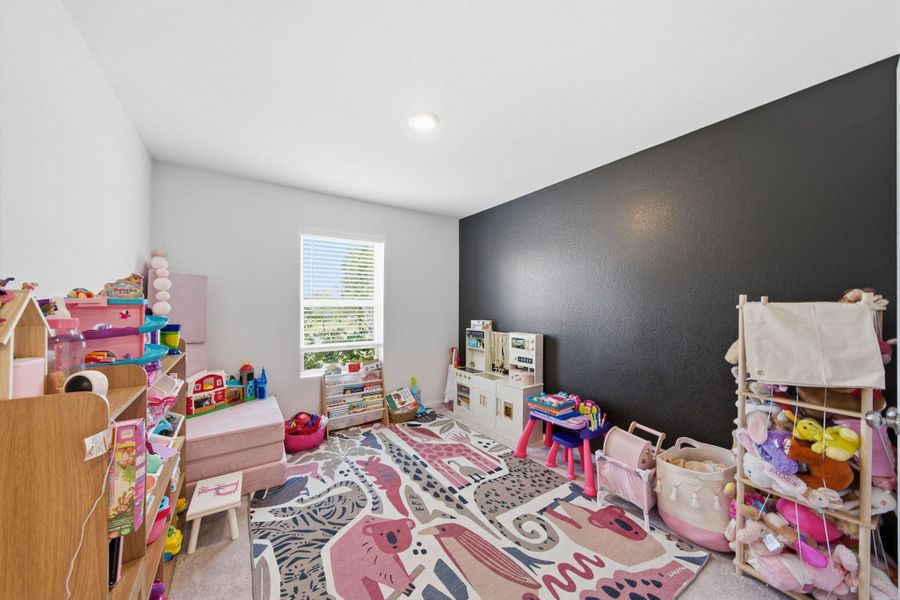 Front bedroom, currently being used as a playroom