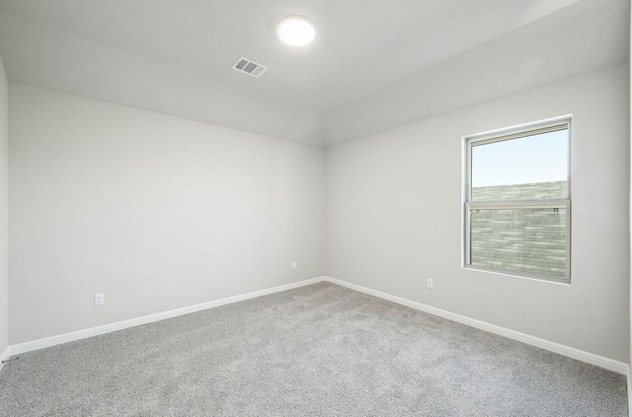 Bedroom in the Willow home plan by Trophy Signature Homes – REPRESENTATIVE PHOTO