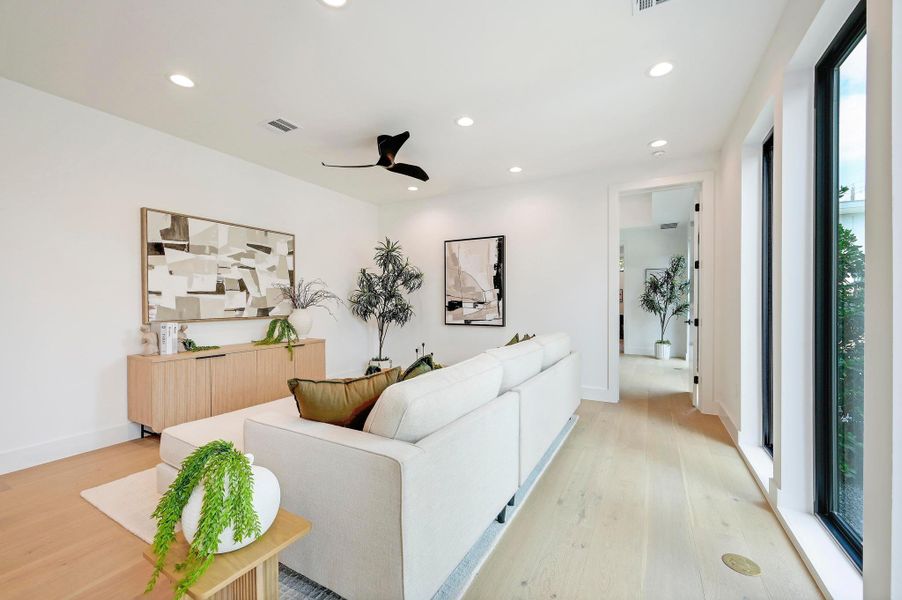 Living area featuring recessed lighting, light wood-style floors, and ceiling fan