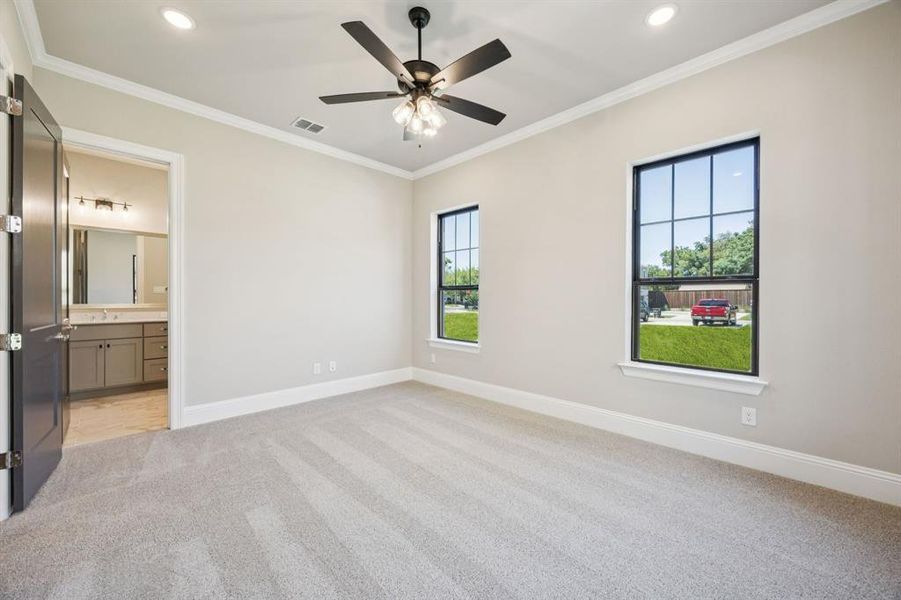 View showing entrance to primary bathroom. View showing entrance to primary bathroom.