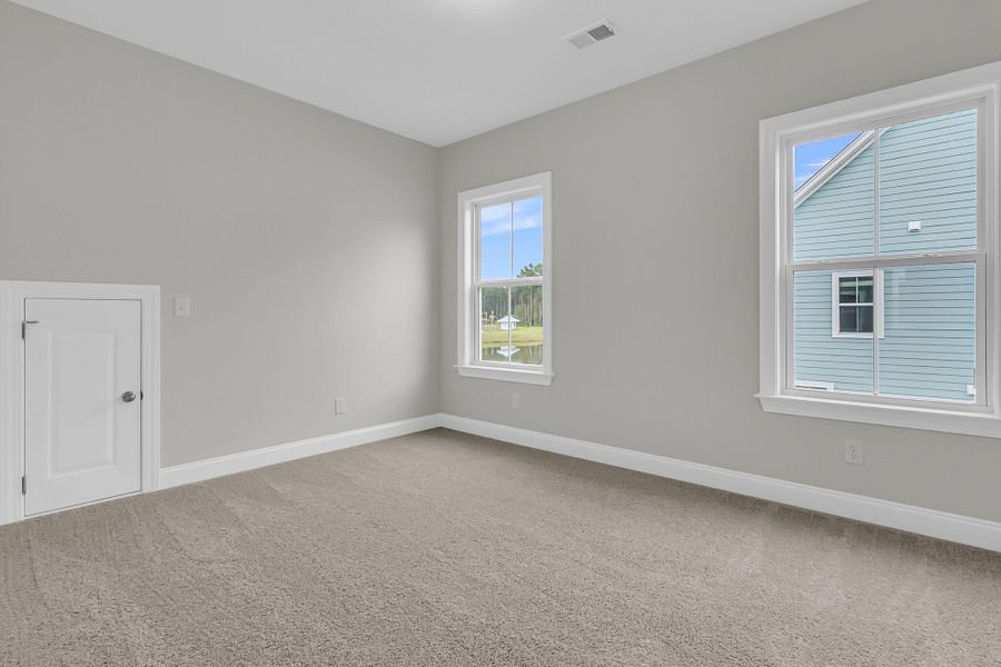 Spacious, unfurnished interior of a new home in Tidewater at Lakes of Cane Bay, Summerville (Image 34).