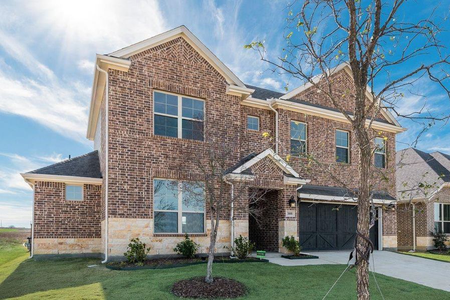 Front exterior of a new home in Arbors at Legacy Hills, Celina, TX, highlighting curb appeal (Image 21).