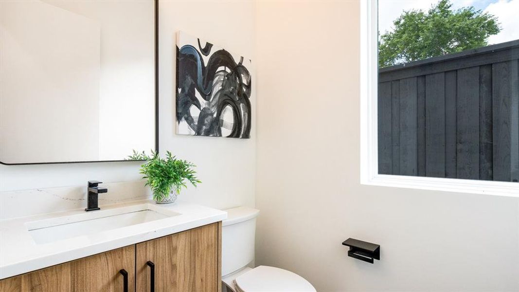 Bathroom with toilet and large vanity