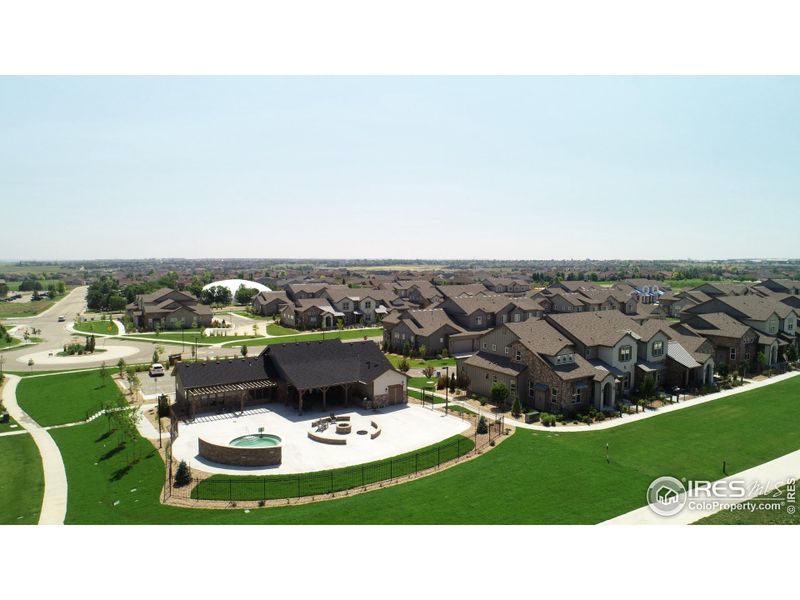 Rear aerial view of Vernazza clubhouse, oversized hot tub, firepit & grilling area Rear aerial view of Vernazza clubhouse, oversized hot tub, firepit & grilling area
