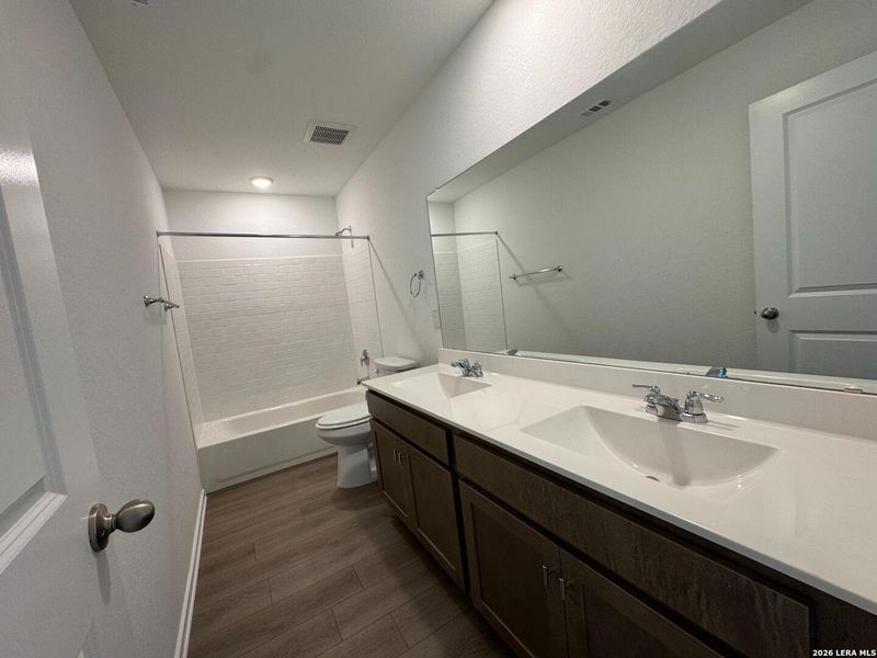 Furnished interior view inside a new home in Hennersby Hollow, San Antonio (Image 13).