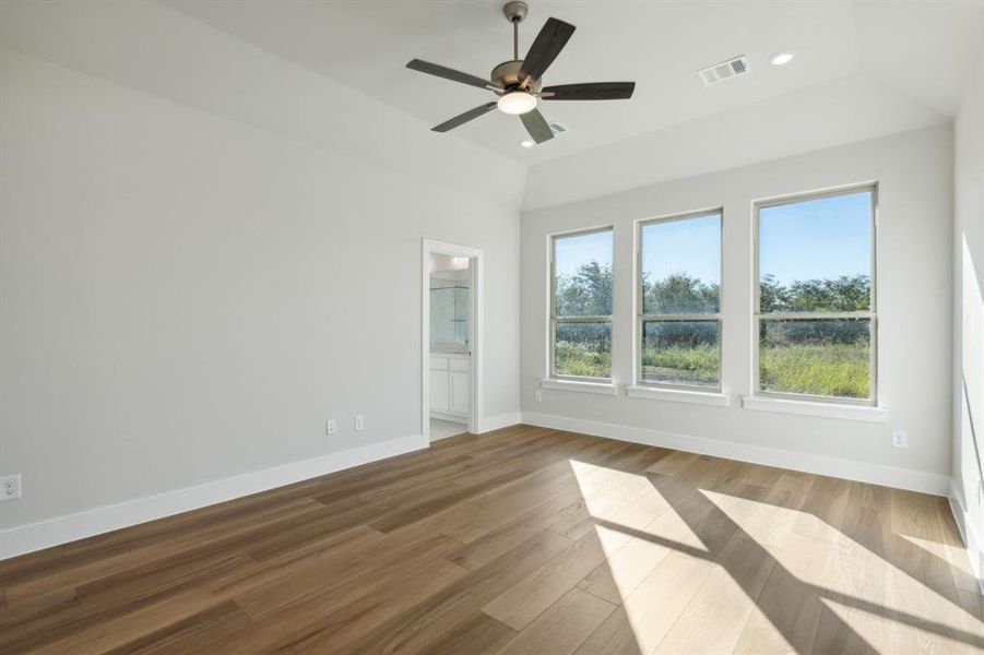 Unfurnished room featuring ceiling fan and hardwood / wood-style flooring