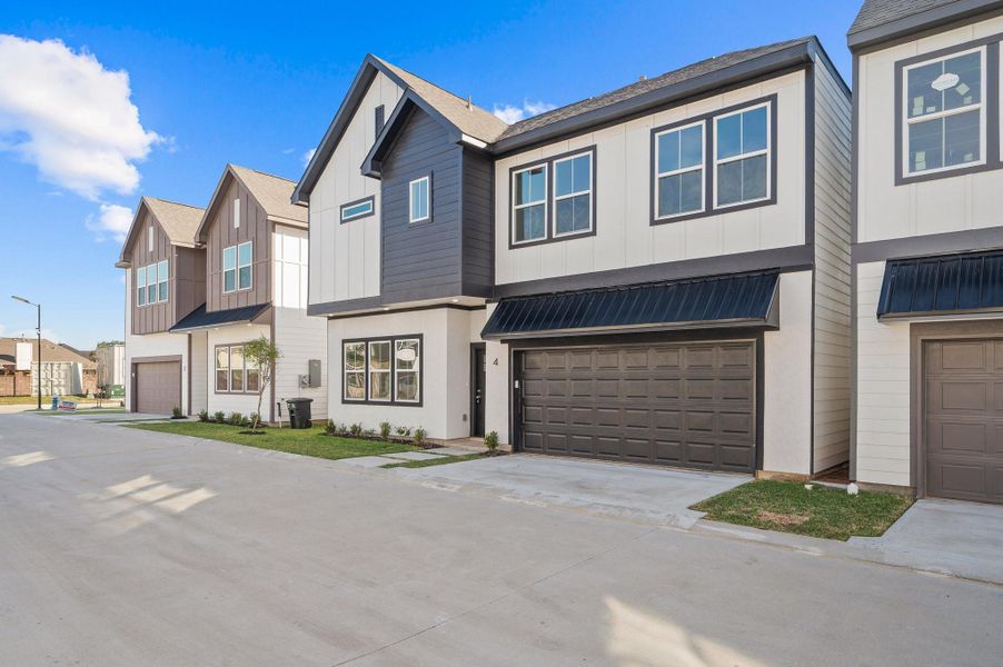Front exterior of a new home in Metro Village, Houston, TX, highlighting curb appeal (Image 2).