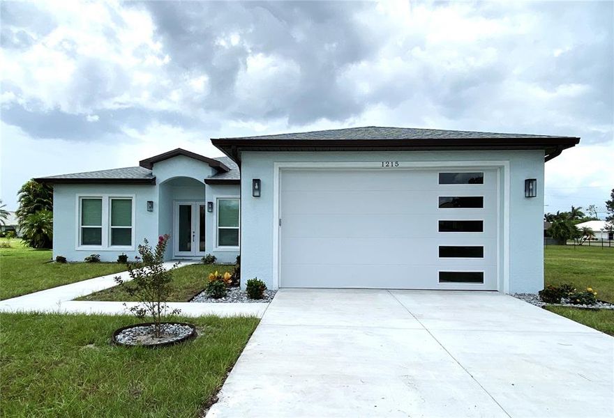 Front exterior of a new home in , Punta Gorda, FL, highlighting curb appeal (Image 26).