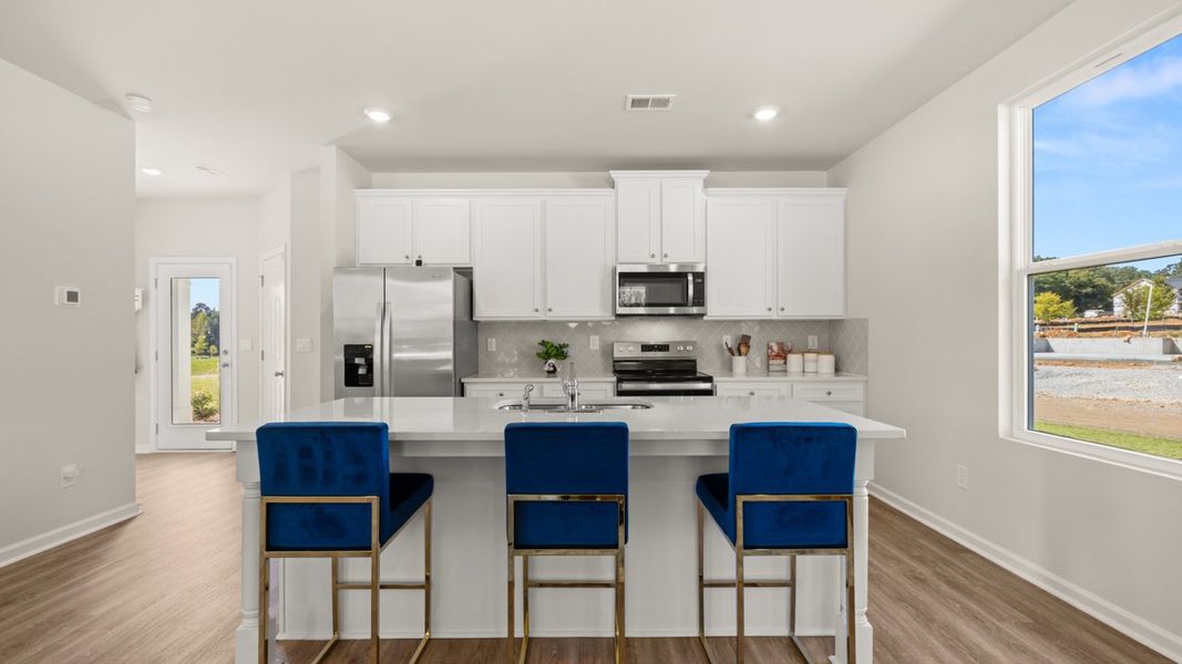 Representative furnished interior of a home built from the Iria Glen by D.R. Horton in Brookland Commons, Monroe (Image 8).