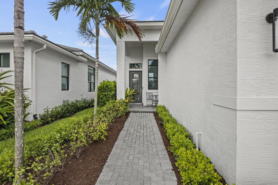 Front exterior of a new home in , Port St. Lucie, FL, highlighting curb appeal (Image 2). Front exterior of a new home in , Port St. Lucie, FL, highlighting curb appeal (Image 2).