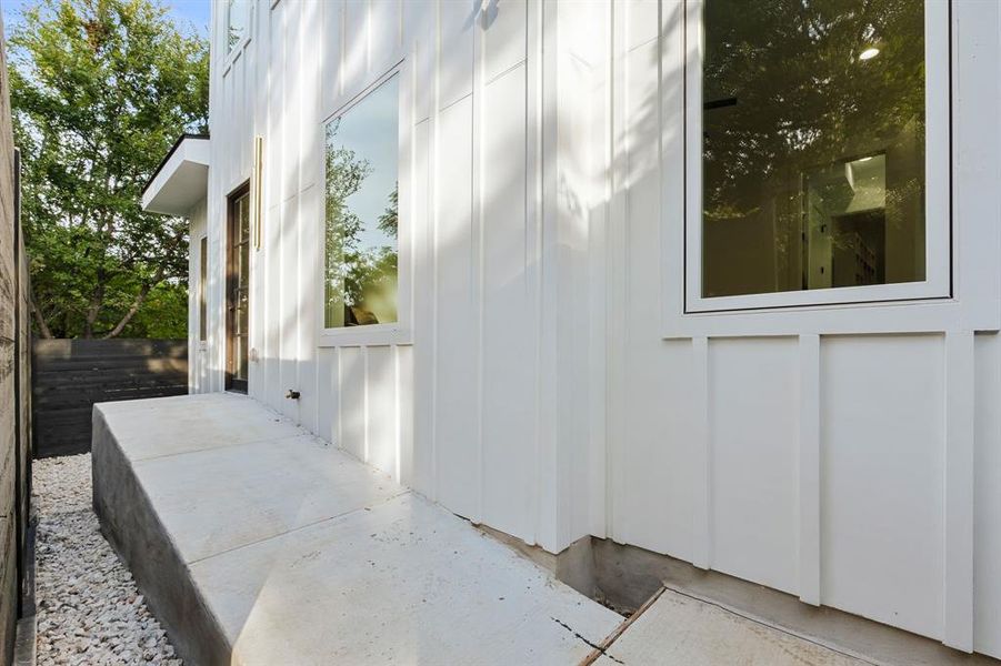 Ramp access to the main living space from back alley behind the property